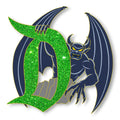 Chernabog with wings spread beside a green glitter Signature D