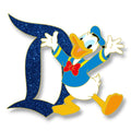 Donald Duck in his blue sailor outfit beside a blue glitter Signature D