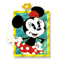 Minnie in a red polka-dot skirt and flower hat on a teal 1928 stamp with a gold border